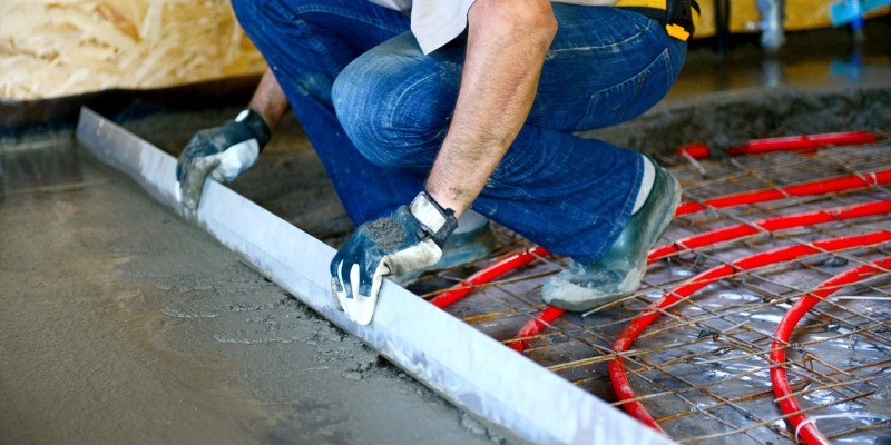 Someone installing hydronic floor heating