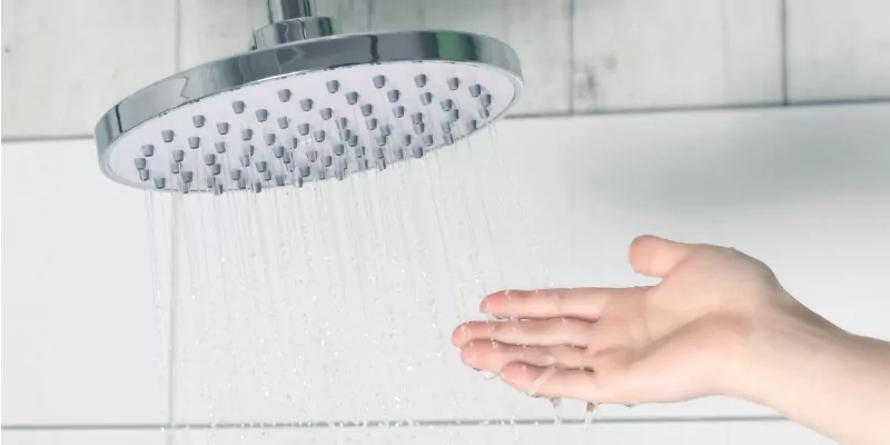 touching water from shower head