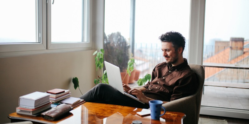 Man working in office with laptop